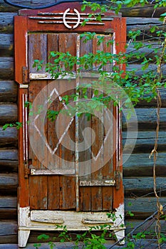 Old wooden Windows with carved patterns in Omsk.