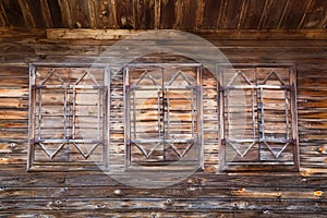 Old wooden windows with closed shutters