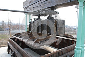 An old wooden wine press for pressing grapes