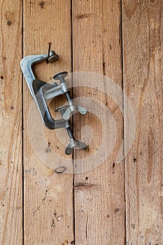 Old work tools hang on the wooden wall.