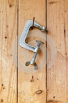 Old work tools hang on the wooden wall