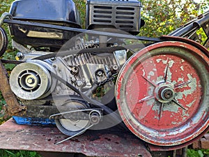 old but working engine from a walk-behind tractor.