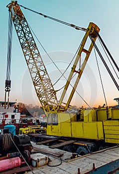 Old working ship and yellow crane in Sava river in Belgrade