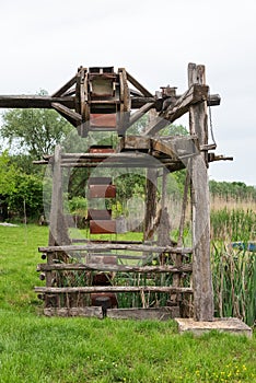 Old working sweep well and shadoof with landscape