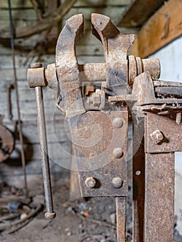 Old workshop smith details with rusty tools and stone walls