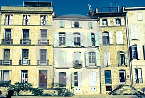 Old world effect split toned entrances and windows and sun bleached shutters to several traditional urban residences in small