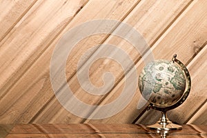 Old World Globe against Plank Wall with Copy Space