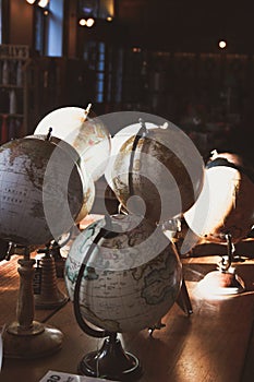 Old world globes in harsh light