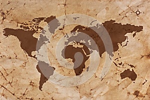 Old World map on creased and stained parchment paper photo