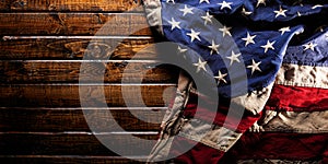 Worn American flag on dark wooden background photo