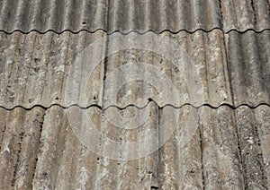 Old worn asbestos roof on small shelter