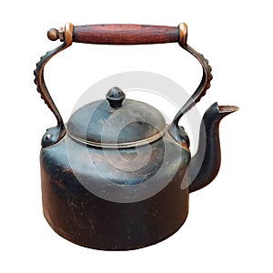 Old worn brown teapot with wooden handle.