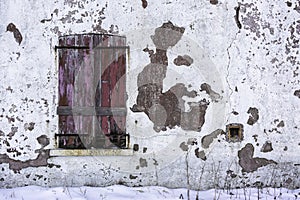 Old and worn closed wooden shutters