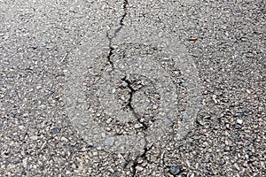 Old worn and cracked asphalt with cracks photo