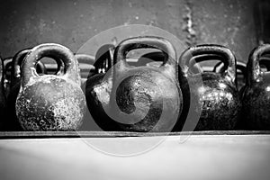 Old worn dumbells in gym photo