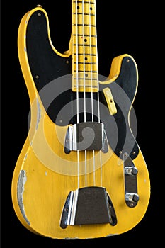 Old, worn electric bass guitar in 1950s style - musical instrument