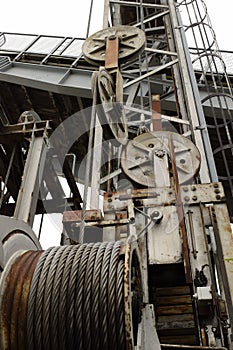 Old worn ferry slip with steel cables and wheels