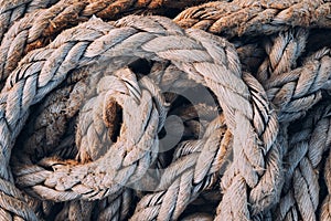 Old worn frayed ship ropes as background