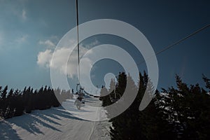 Old and worn gondola or ski lift on Soriska planina in slovenia on a sunny winter day