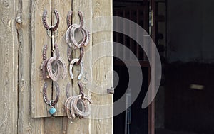 Old worn horseshoes displayed on wall of stables