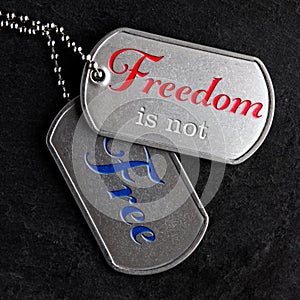 Old military dog tags - Freedom is not Free photo