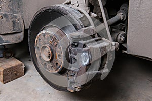 An old worn-out brake disc requiring replacement.