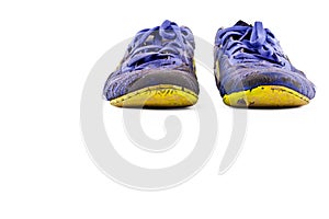 Old worn out dirty blue futsal sports shoes on white background football sportware object isolated