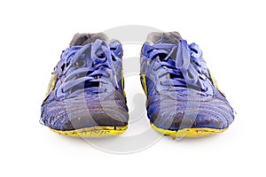 Old worn out dirty blue futsal sports shoes on white background football sportware object isolated