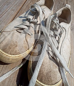 Old worn out and dirty white sneakers