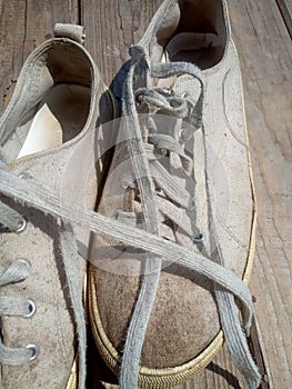 Old worn out and dirty white sneakers