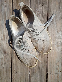 Old worn out and dirty white sneakers