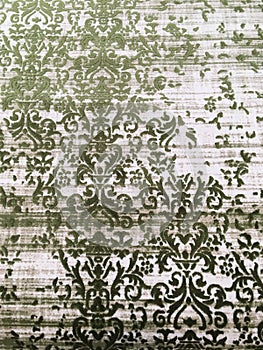 Old worn out elegant damask pattern carpet / floor covering. Luxury grunge vertical background