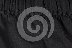 Old worn-out polyester and elastane fabric, pilling and frayed threads