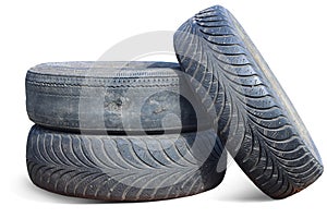 old worn out tire next to another old tire isolated on white background