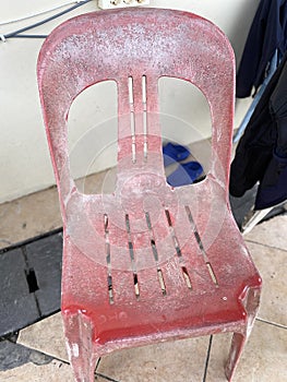 the old and worn pink chairs had turned white