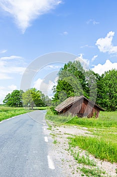 Old Worn Red Barn Near Road