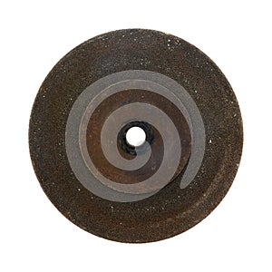 Old worn and used grinding wheel on a white background