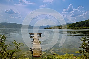 Old worn wooden pier on the border of Danube river