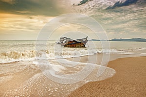 Old wreck boat on abandoned sea beach
