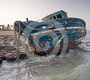 Old wrecked boat on the beach