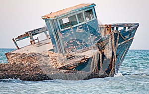 Old wrecked boat on the beach