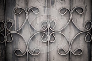 Old wrought iron bars on the gate with grunge and rusty steel b