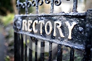 Old wrought iron Holy Trinity Rectory Gates with peeling paint a