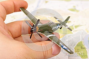 Old WWII model plane in the male hand