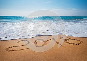 Old Year 2018 expires concept sandy tropical ocean beach lettering concept image