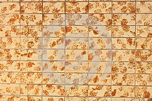 Old yellow brown tile wall texture background