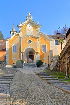 Old yellow church in orta San Giulio village in italy