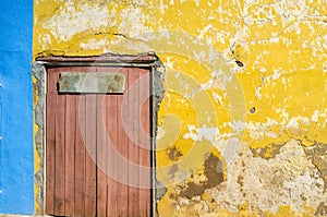Old yellow colonial houses in the center of Trinidad, Cuba photo