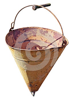 The old yellow hollow fire triangle bucket hangs on the nail.