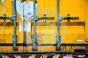 Old yellow shipping container door